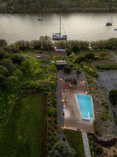 an aerial view of a house with a swimming pool at Apartamento para pareja, Finca Contrabando. Sanlucar del Guadiana in Sanlúcar de Guadiana