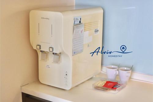a microwave oven sitting on top of a counter at Alviv 99 Suites I Family Suite I 4-7 pax I 5minsMelakaCruise I JonkerSt in Melaka