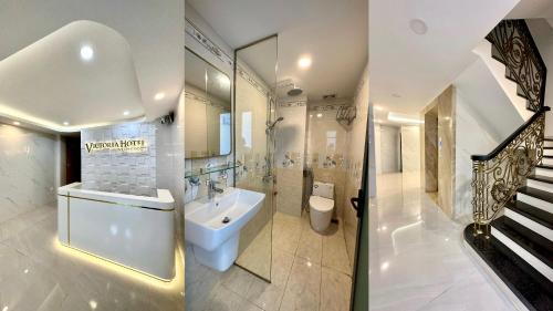 uma casa de banho com um lavatório, um WC e uma escada. em Victoria Hotel em Ho Chi Minh