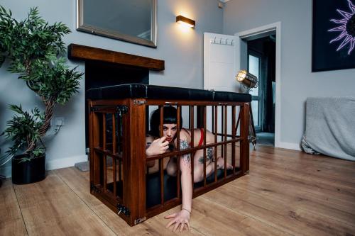a girl is laying in a crib at Naughty Shades of Brighton in Brighton & Hove