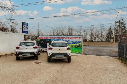 two cars parked in front of a gas station at Business Transit to Therme & Bucharest Airport in Săftica