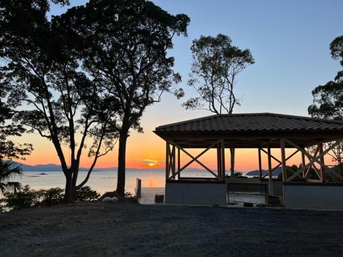 a gazebo with a sunset in the background at LaVilla - Vacation STAY 27602v in Nobotate