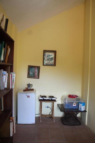 a room with a white refrigerator and a table at Villa Stellia @drvacationsrental in La Laguna