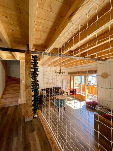 a living room with a wall of glass at La MaiZon du Bois in Champagny-en-Vanoise