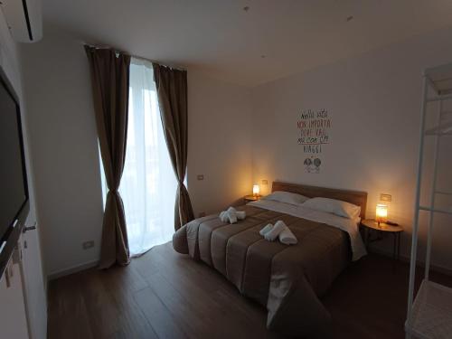 En eller flere senge i et værelse på Dimora Crispi 70