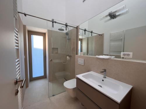 a bathroom with a toilet and a sink and a shower at Villa Boris in Starše