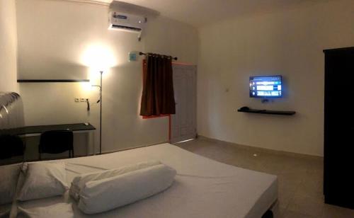 Katil atau katil-katil dalam bilik di Siger Hotel