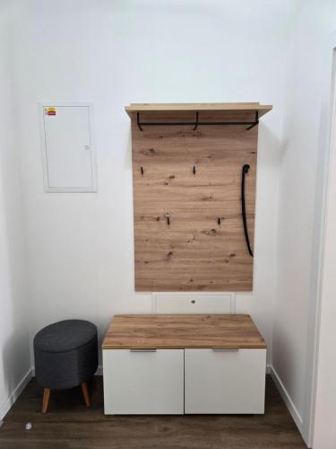 a desk and a chair in a room at Penzion TONNY in Podivín