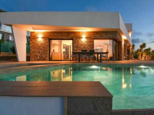 una villa con piscina frente a una casa en Villa Villa Orion by Interhome, en Jávea