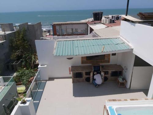 an aerial view of a white building with a green roof at Dreimar Hotel Boutique in Cartagena de Indias