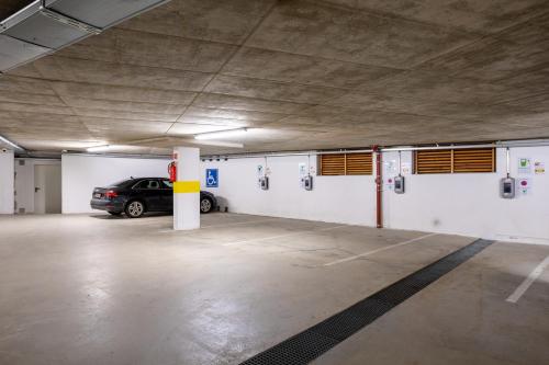 a parking garage with a car parked in it at Der Schütthof in Zell am See