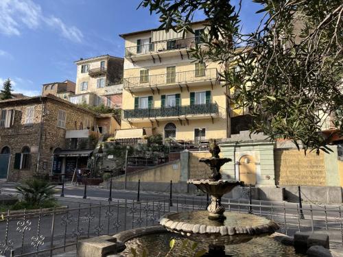 a water fountain in front of a building at Apartment Marina by Interhome in Dolcedo