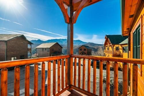 a view from the balcony of a cabin with mountains in the background at Full Equipped Cabin with a Pool and Game Room Smokies Views in Gatlinburg