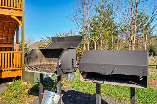 a barbecue grill on display in a yard at Full Equipped Cabin with a Pool and Game Room Smokies Views in Gatlinburg