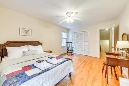 a bedroom with a bed with a ceiling fan and a desk at Richmond Vacation Rental about 10 Mi to Downtown! in Richmond