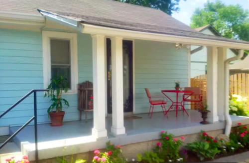 a porch of a house with a table and chairs at Truly Central Private Guest House in Nashville