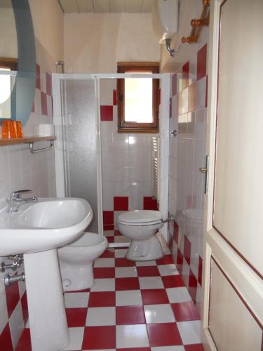 a bathroom with a sink and a toilet at Agriturismo Le Macine in Florence