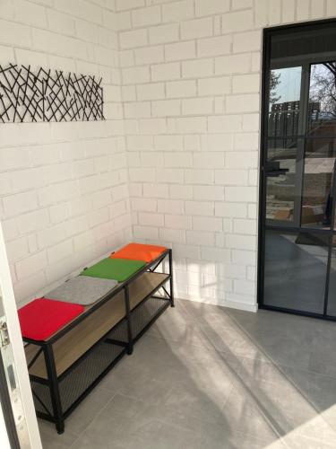 a bench sitting in a room with a wall at Ferienwohnung Zweinig 04 in Roßwein