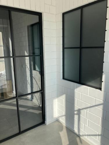 a glass door on a wall with a window at Ferienwohnung Zweinig 04 in Roßwein