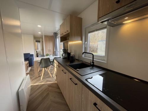 a kitchen with a sink and a counter top at Holiday Home Tiny Haus Anellie by Interhome in Riedenburg