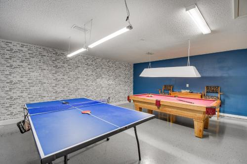 a ping pong table in a room with a ping pong ball at Orange Beach Home with Hot Tub Less Than 2 Mi to The Wharf in Orange Beach
