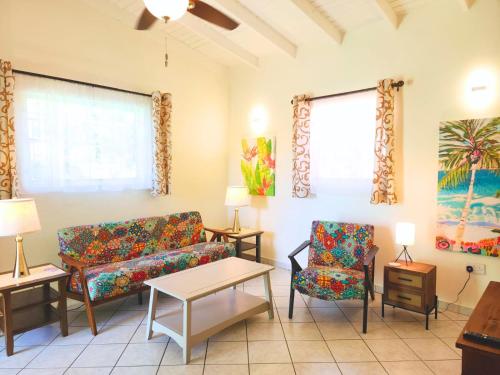 a living room with a couch and two chairs at Ti Brico Gros Islet Bungalow in Gros Islet