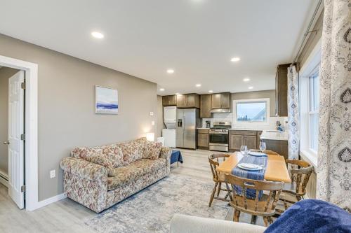 a living room with a couch and a table at Newly Renovated Maine Retreat Deck with Ocean View! in Lubec
