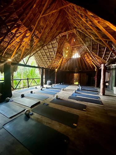 a group of yoga mats in a large building at Sueños Tulum in Tulum