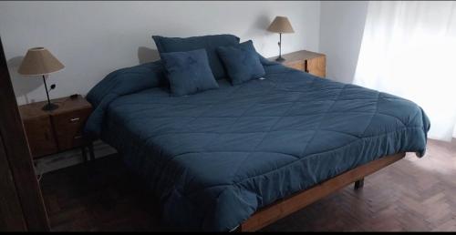 En eller flere senge i et værelse på Los Nogales Tandil