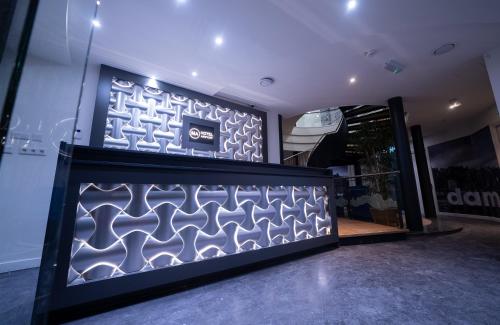 a store front with a blue and white wall at MA Airport Hotel in Hoofddorp