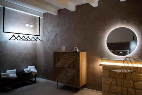 a bathroom with a sink and a mirror at SantaTeresa19 Suite & Spa in Palermo