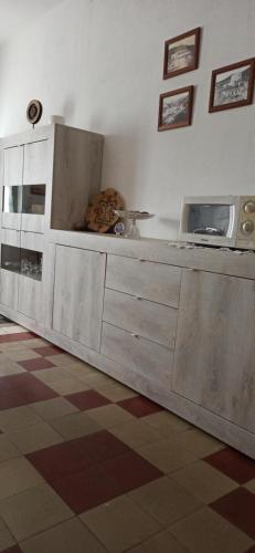 a kitchen with a sink and a microwave at Borgo Ingurtosu in Ingurtosu