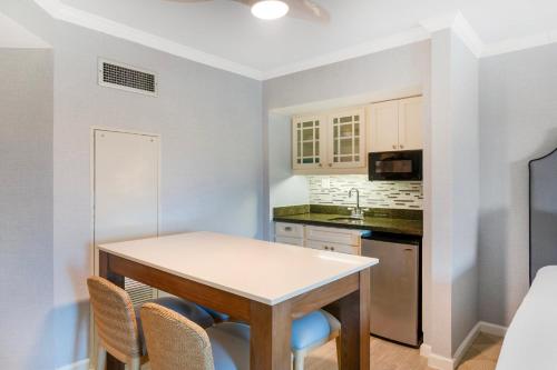 a kitchen with a table and chairs in a room at Omni Hilton Head Oceanfront Resort in Hilton Head Island