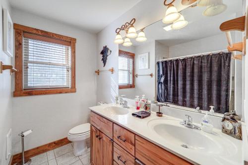 a bathroom with a sink and a toilet at 1 Mi to Beech Mtn Skiing: Family Cabin w/ Fire Pit in Beech Mountain