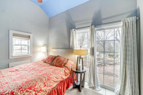 a bedroom with a bed and a window at Historic Cabin with Yard 1 Mi to Lake Spavinaw! in Spavinaw