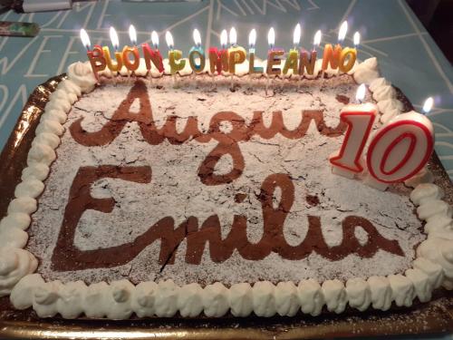 a birthday cake with candles on top of it at Cà Gennara Agri B&B in Porretta Terme