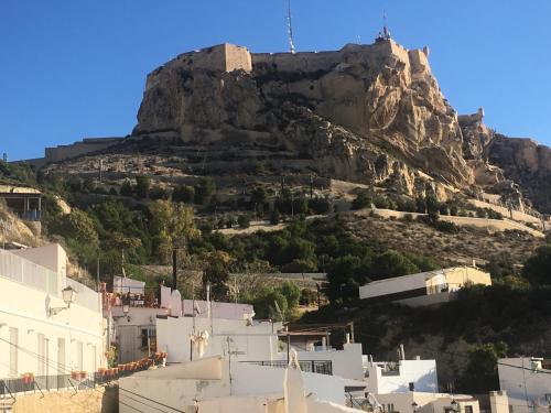 a view of a mountain with houses and buildings at Apartamentos Boni in Alicante