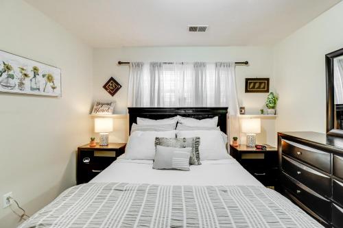 a bedroom with a large white bed with two night stands at Cozy Centreville Apt Close to Historic Sites in Centreville