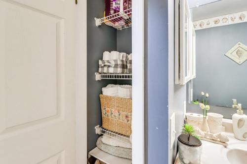 a small bathroom with a sink and towels at Cozy Centreville Apt Close to Historic Sites in Centreville