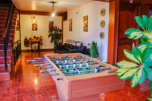 a living room with a large foos ball at Las Torrecitas in Carhuaz