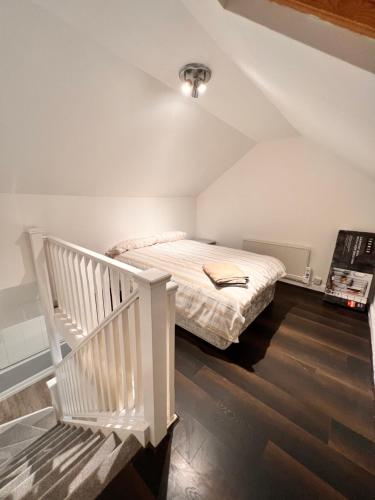 a bedroom with a bed in a attic at 82a Nelson Street in Kettering