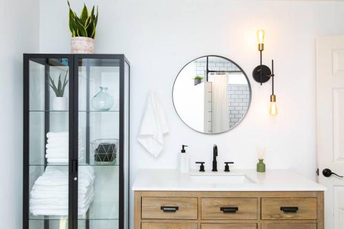 a bathroom with a sink and a mirror at Desert Escape+Art studio+Trailer in Sunfair Heights