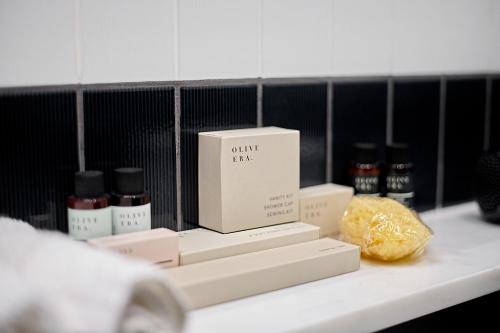 a box sitting on a shelf with other products at SoHo Athinas 60 in Athens