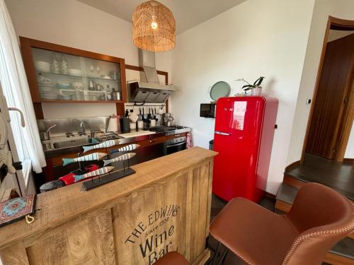 a kitchen with a red refrigerator and a counter at Villa Marta in Levanto