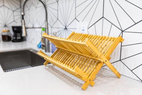 a wooden bench sitting in the middle of a kitchen at Stylish Casita min from the beach ! in San Juan Capistrano
