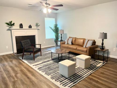 a living room with a couch and a fireplace at Queen Suite Outdoor Hot Tub Wifi Room 2 in Atlanta