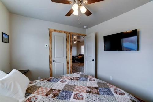 a bedroom with a bed and a ceiling fan at Angel Rock Rentals of Moab Unit 11 in Moab