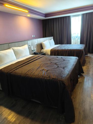Postel nebo postele na pokoji v ubytování Hotel Max