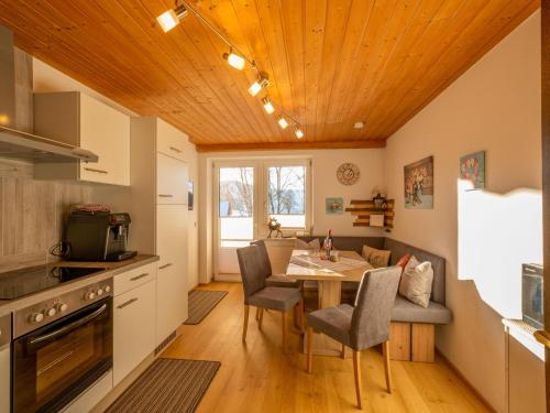 a kitchen and dining room with a table and chairs at Ferienwohnung Krimbacher in Brixen im Thale