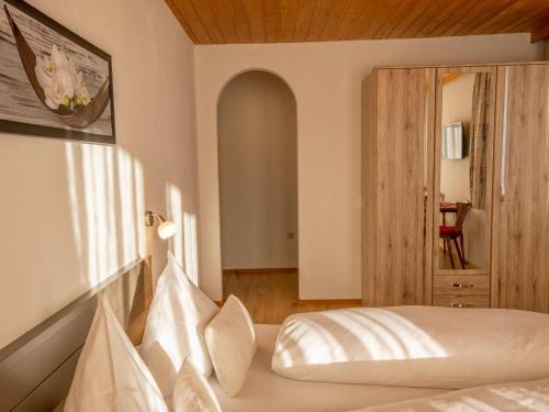 a hotel room with a bed and a window at Ferienwohnung Krimbacher in Brixen im Thale